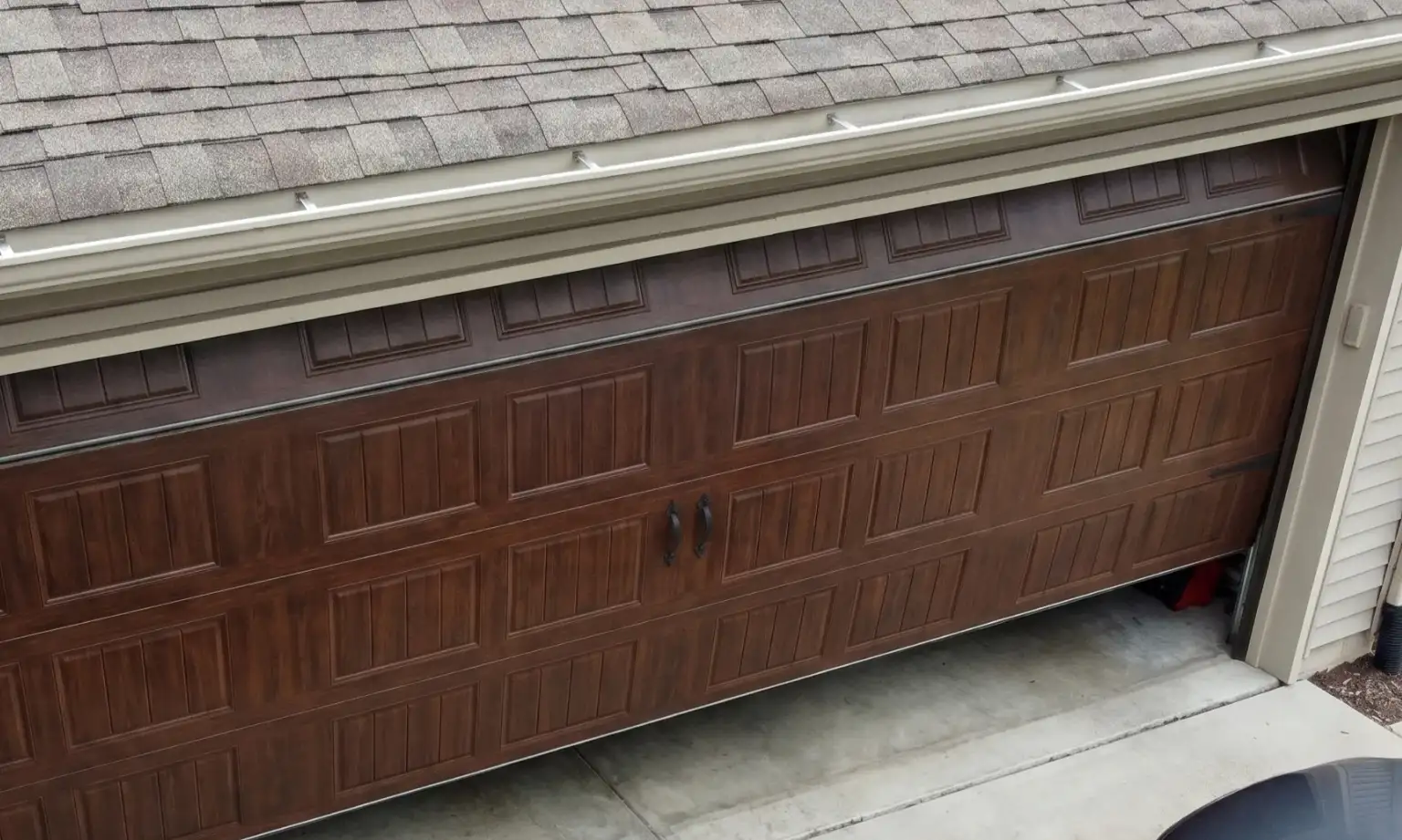 Replacing a Panel on a Garage Door: DIY or Call a Pro